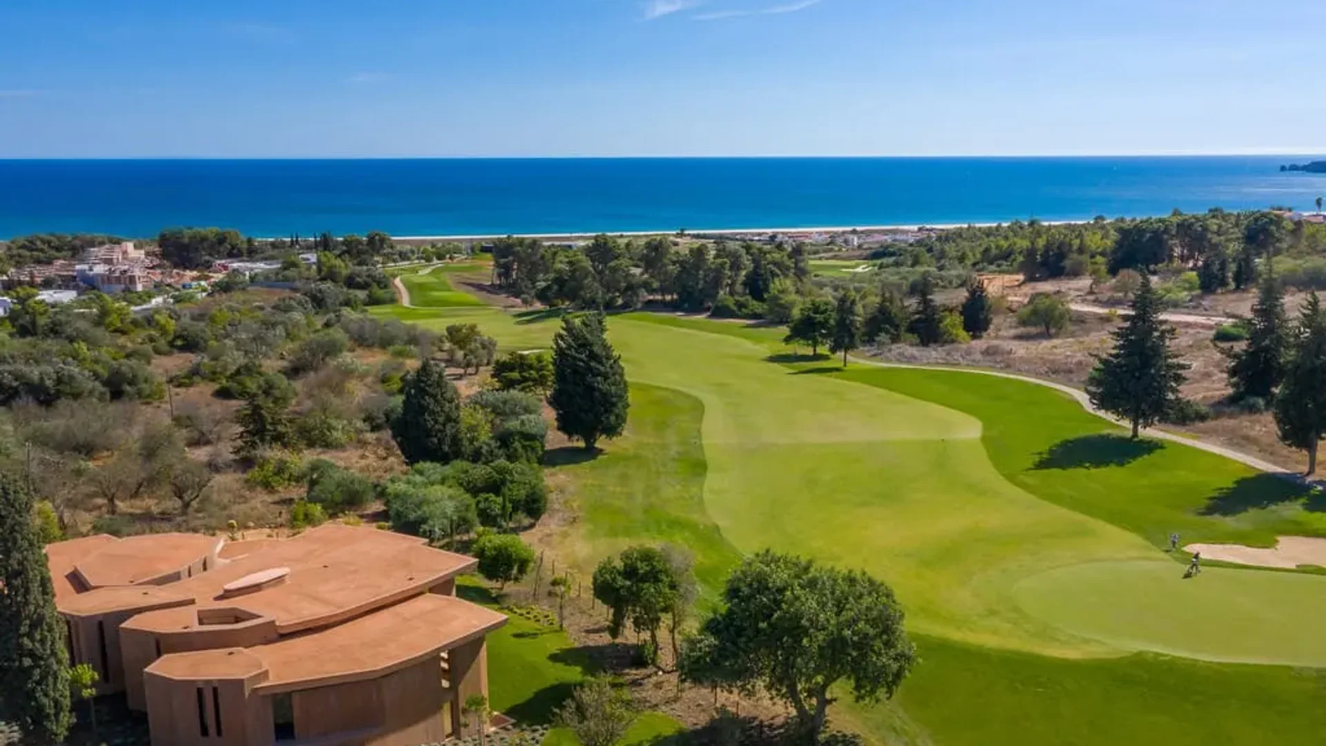 Palmares golf course fairways and nearby homes overlooking the Atlantic coast in the Algarve